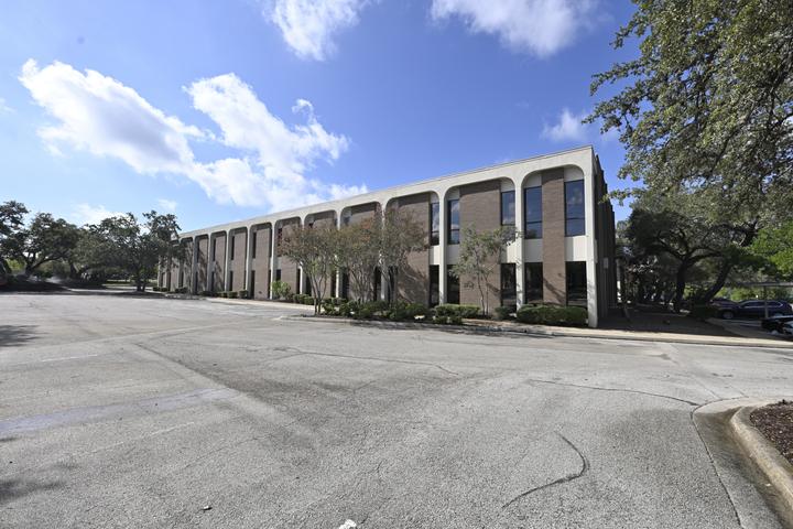 Amistad Building — Two-storey arcade frontage and parking